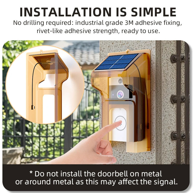 Wireless solar video doorbell with a protective amber cover, shown mounted to a wall with a finger pressing the button.