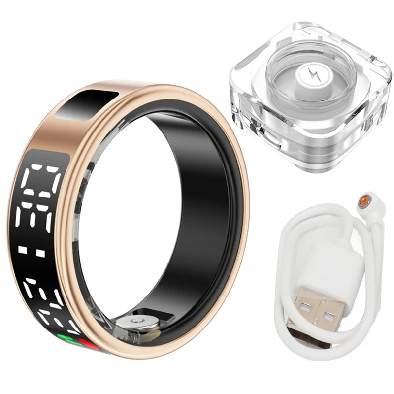 Rose gold smart fitness ring with a black digital display, including a clear magnetic charging dock and USB cable.