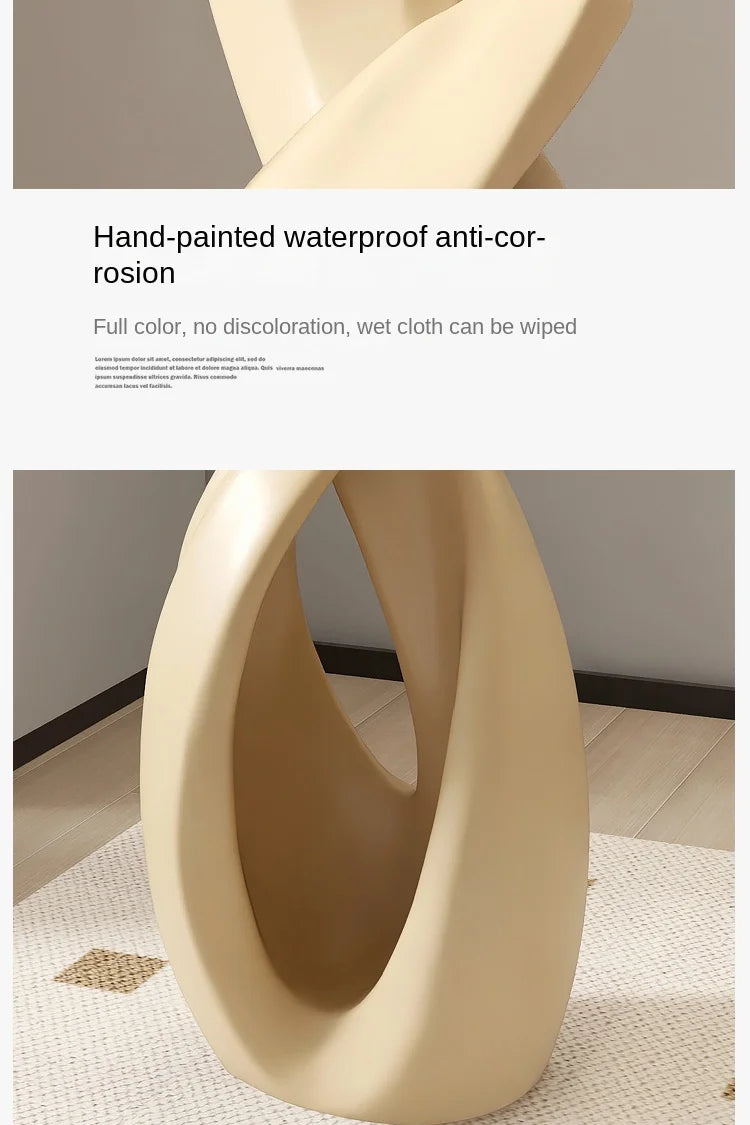 Smooth, cream-coloured abstract resin floor sculpture with a modern, twisted oval design.