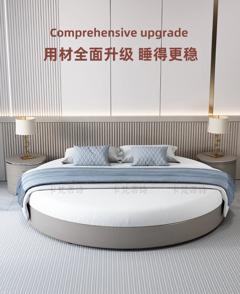 Modern minimalist circular bed frame in a soft grey finish with a matching textured headboard and blue bedding.