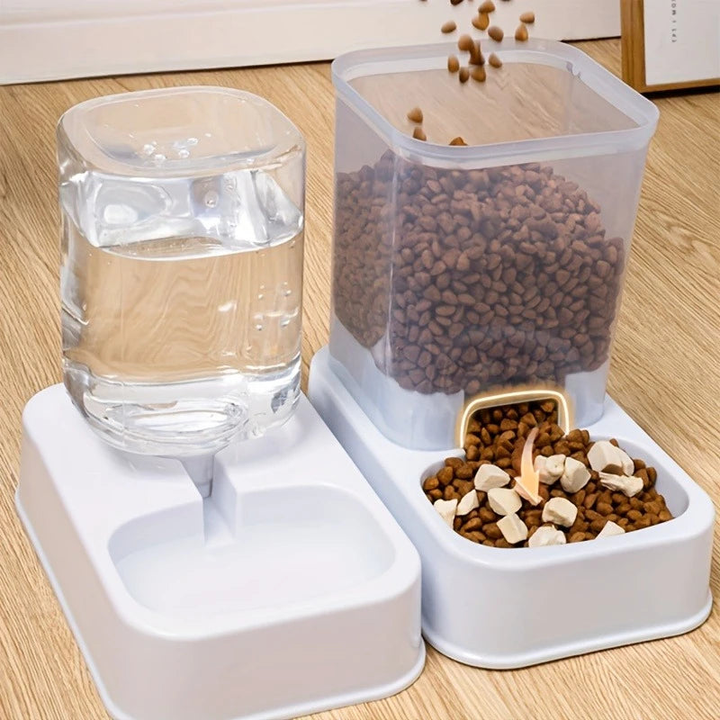 Clear plastic pet water dispenser and gravity food feeder with white base on wooden floor.