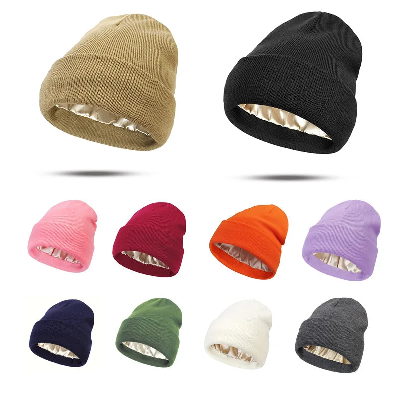 A variety of women's knitted beanies in different colours, all featuring a smooth, satin-lined interior.