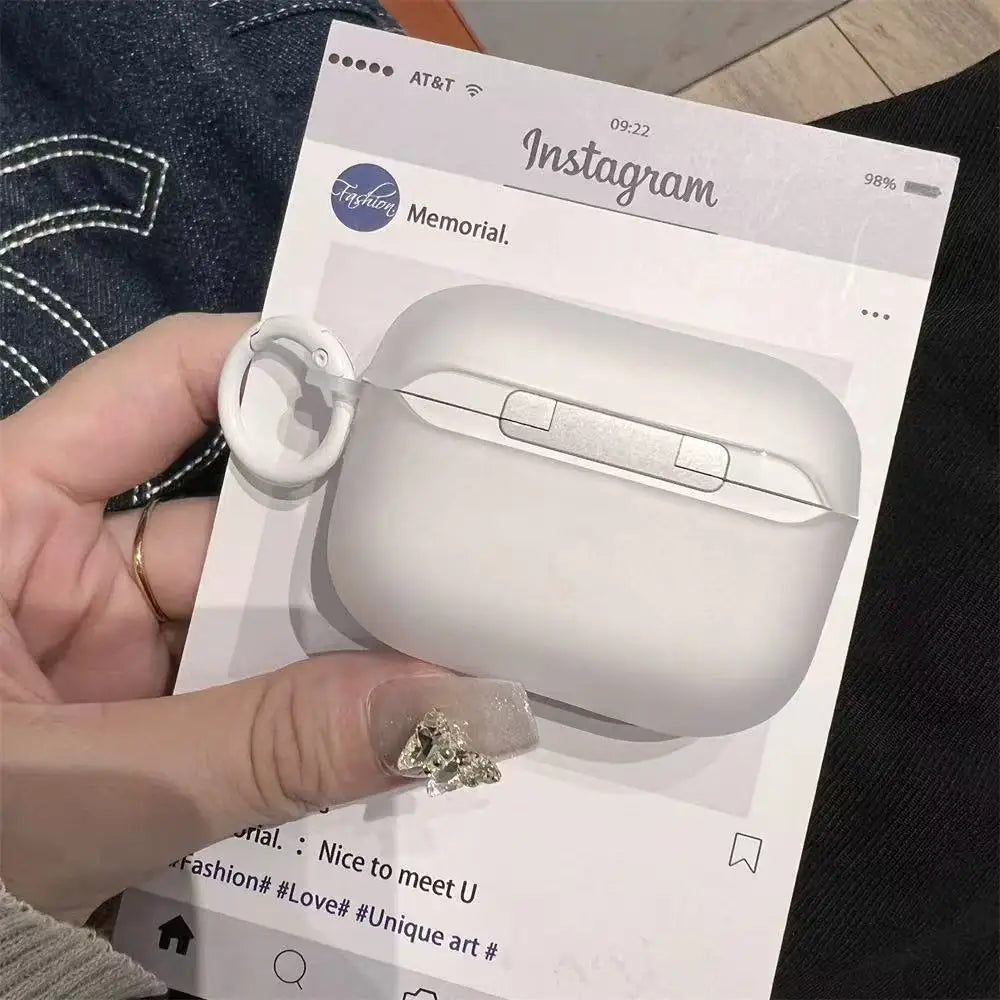 Matte white silicone protective case for AirPods Pro with an attached white carabiner ring.