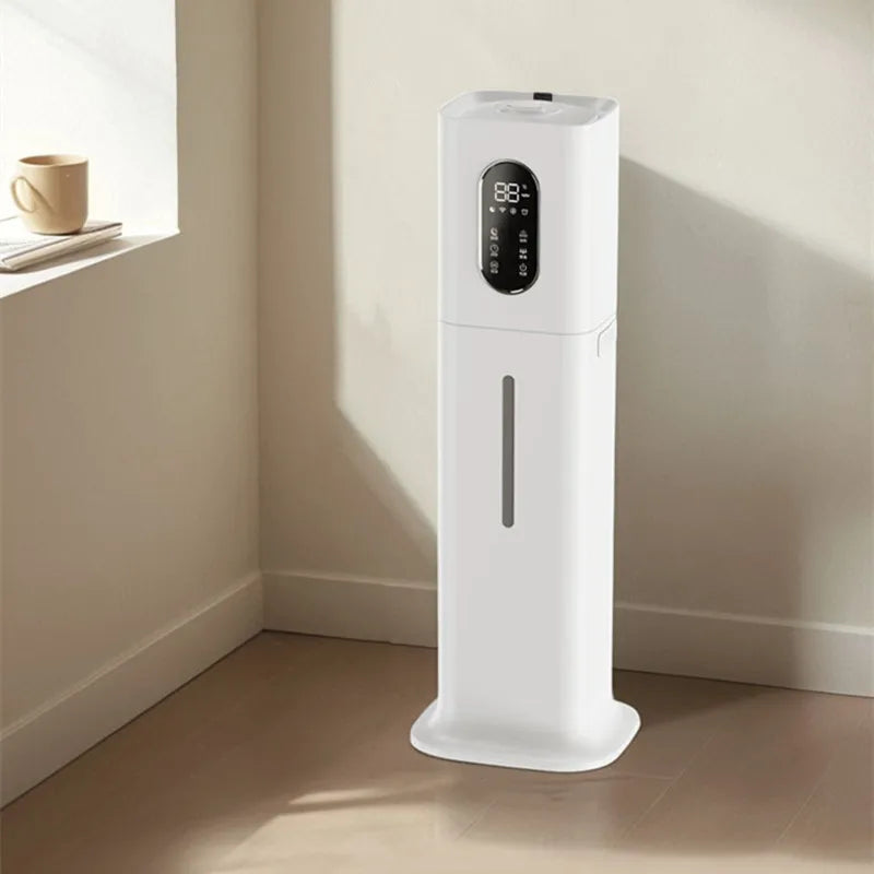 Tall, slim white ultrasonic humidifier with a digital display screen and water level window, standing on a wooden floor.