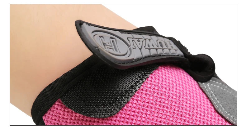 Close-up of a pink mesh glove on a wrist, featuring a grey rubberised 'HUWAI' branded velcro strap.