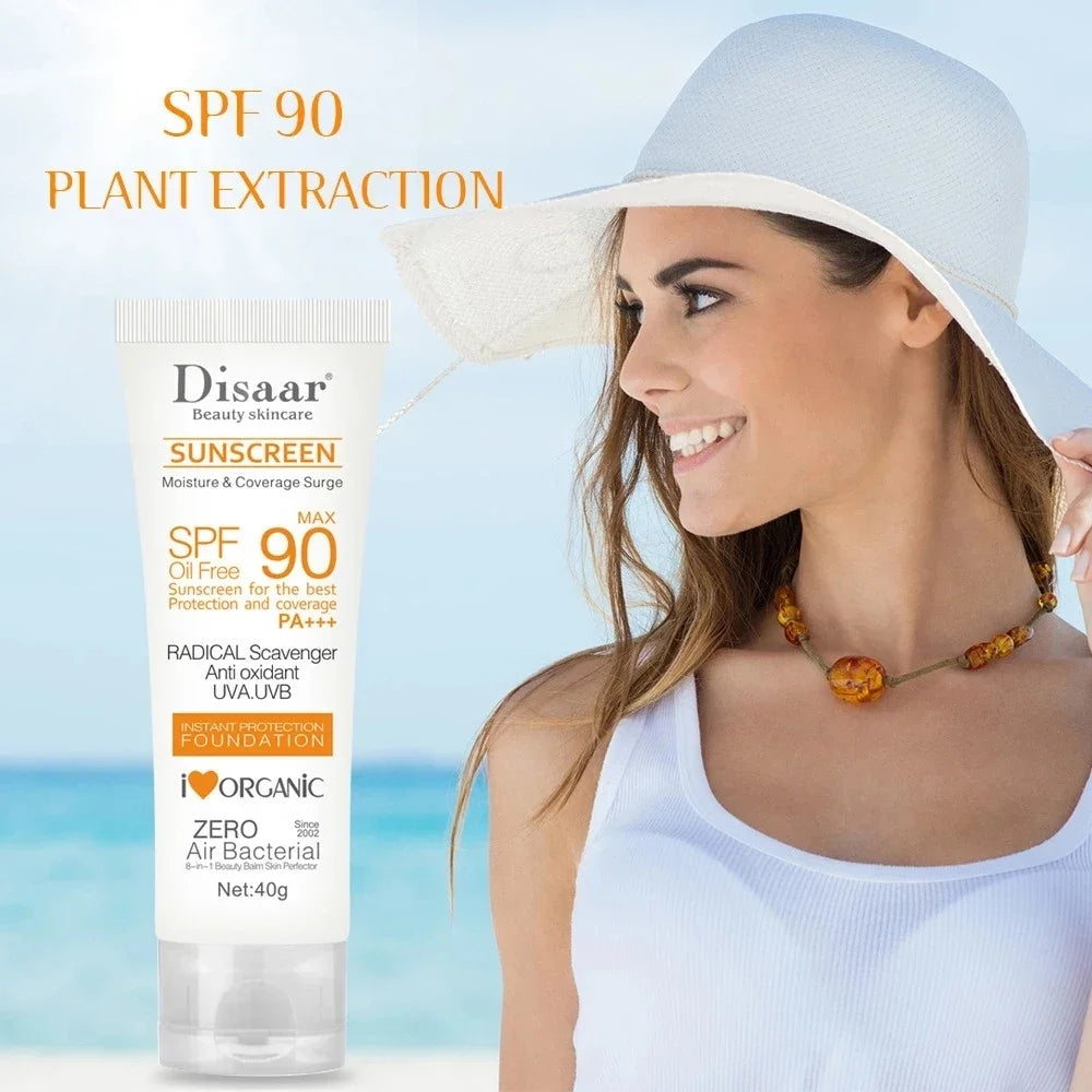 White 40g tube of SPF 90 oil-free plant extract sunscreen foundation, shown with a smiling woman in a beach setting.