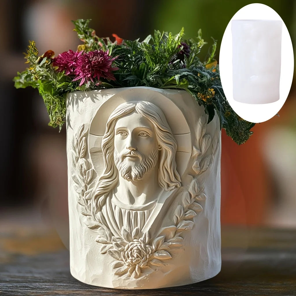 White cylindrical silicone mold with a textured Jesus face relief, alongside a finished flower pot filled with plants.