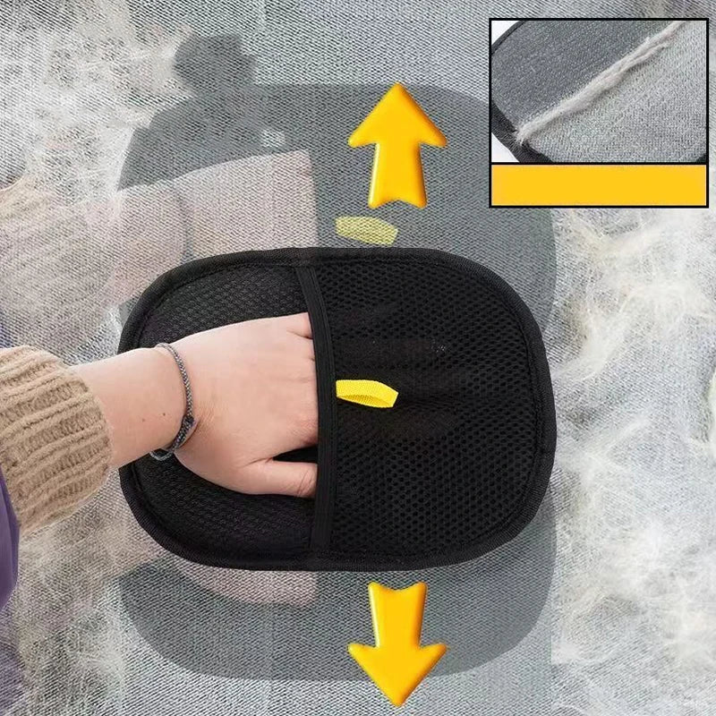 Black mesh hand mitt for removing pet hair from fabrics, featuring a yellow tag and directional arrows.