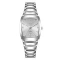 Ladies' silver stainless steel quartz watch with a tonneau-shaped face, diamond accents and a date display.
