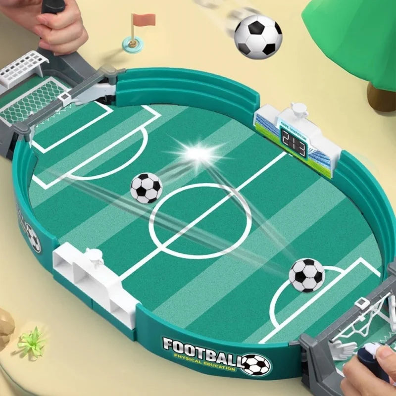 Tabletop football game in teal with a digital scoreboard, white goals, and two miniature black and white footballs.