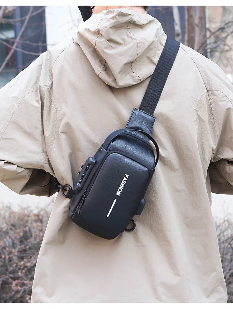 Black anti-theft sling bag with a USB port and combination lock, worn across the back over a beige jacket.