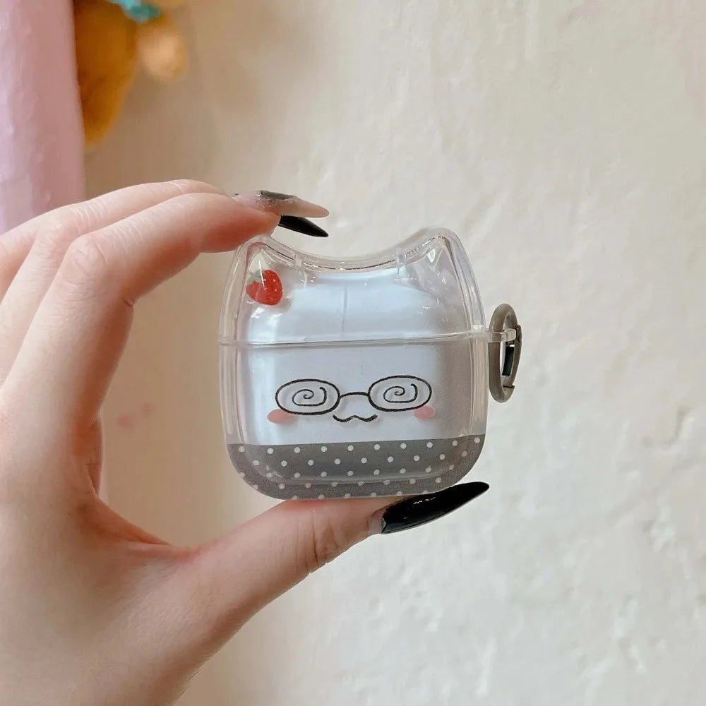 Clear cat-ear AirPods case with strawberry and glasses print, featuring a polka-dot base for standard AirPods.