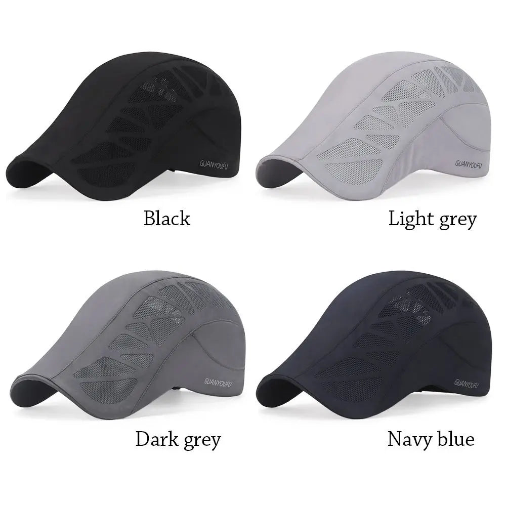 Four men's flat caps in black, light grey, dark grey, and navy blue, featuring breathable mesh side panels.