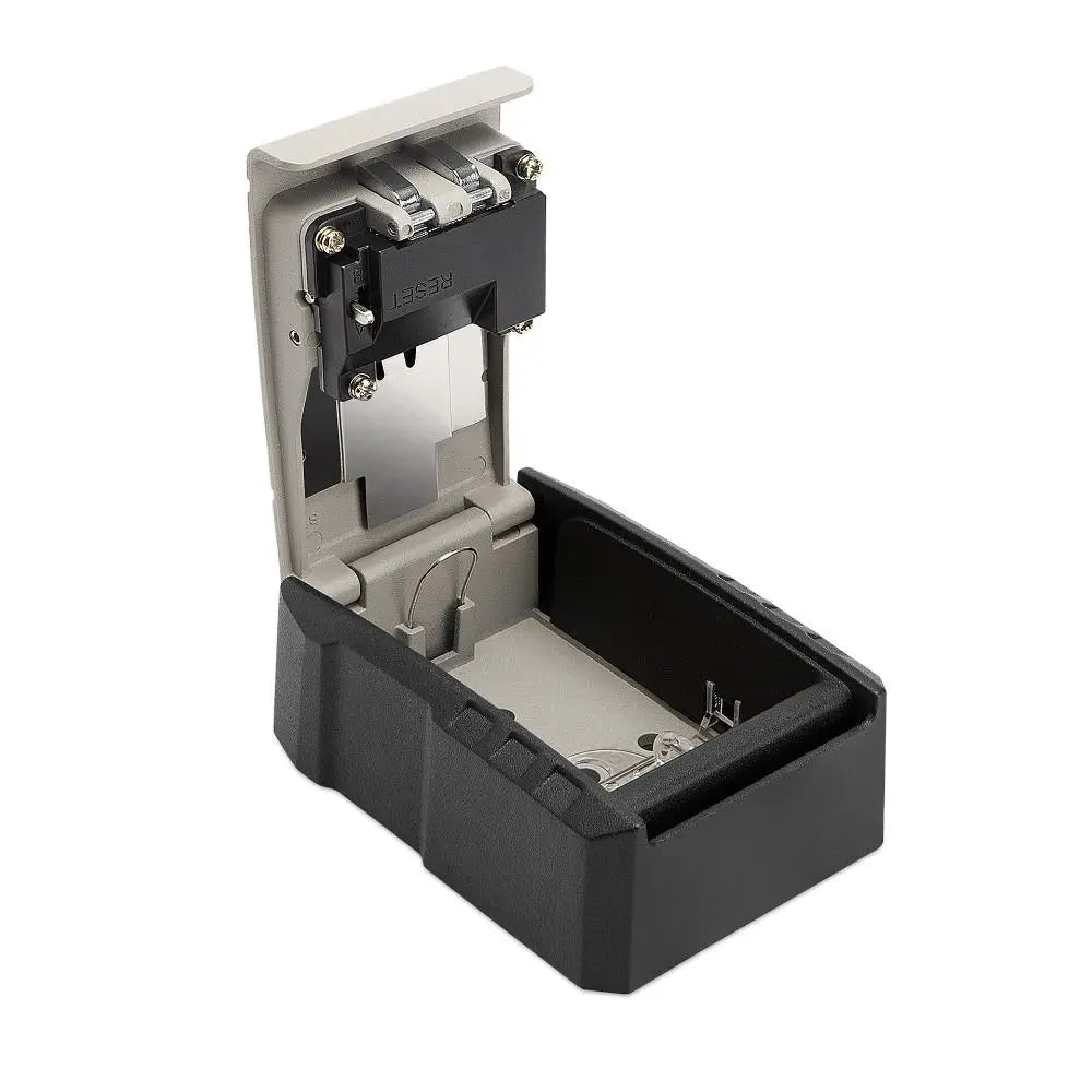 Open black and grey metal wall-mount key lock box with an internal reset button mechanism.