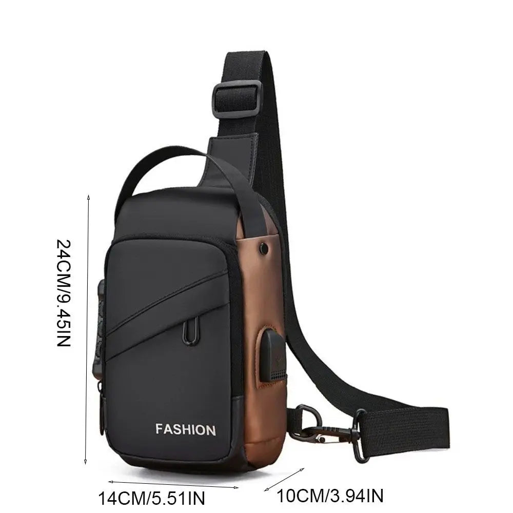 Black and brown crossbody chest bag with an adjustable strap, top handle, and built-in USB charging port.