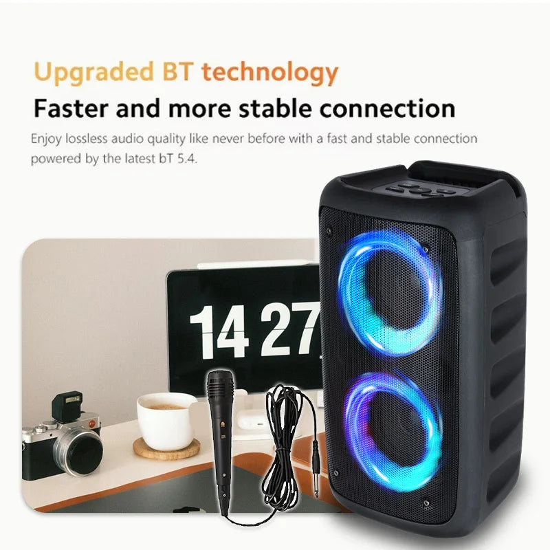 Portable black wireless speaker with glowing blue LED light rings and a wired microphone.