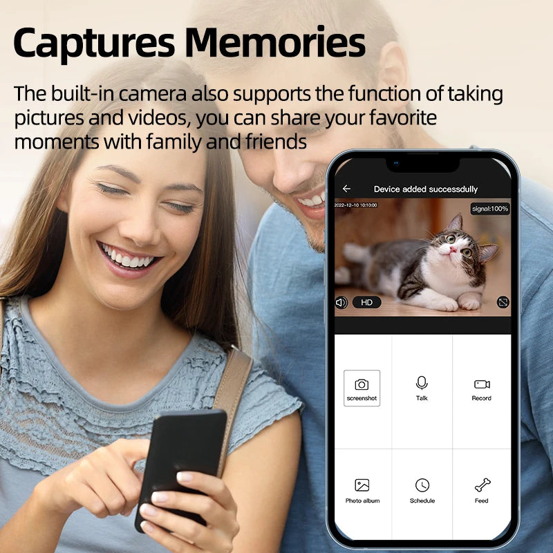 Couple viewing a pet camera app on a smartphone, featuring a live feed of a cat and various control icons.