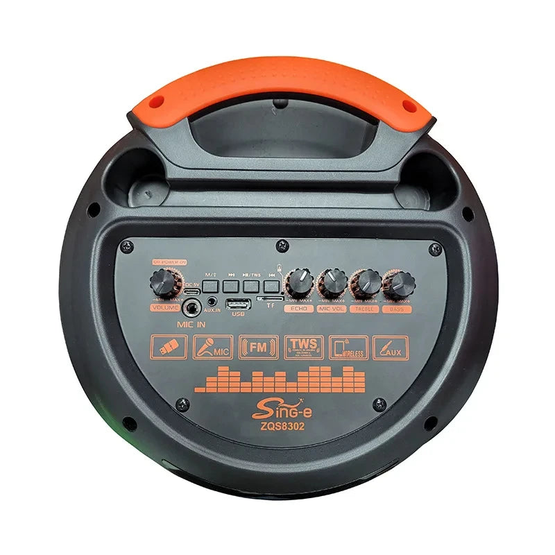 Top-down view of a portable black and orange party speaker with control dials and a carry handle.