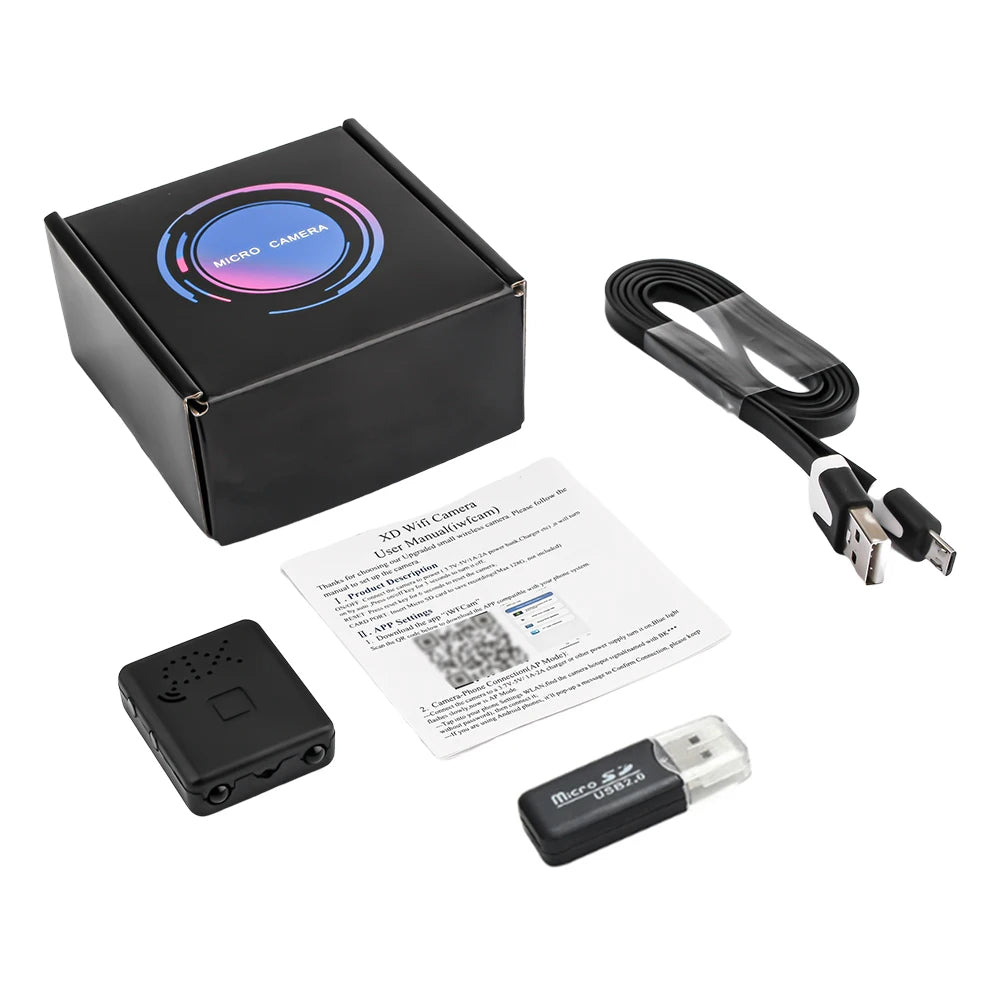 Small black plastic wireless camera with charging cable, memory card reader, box, and user manual.