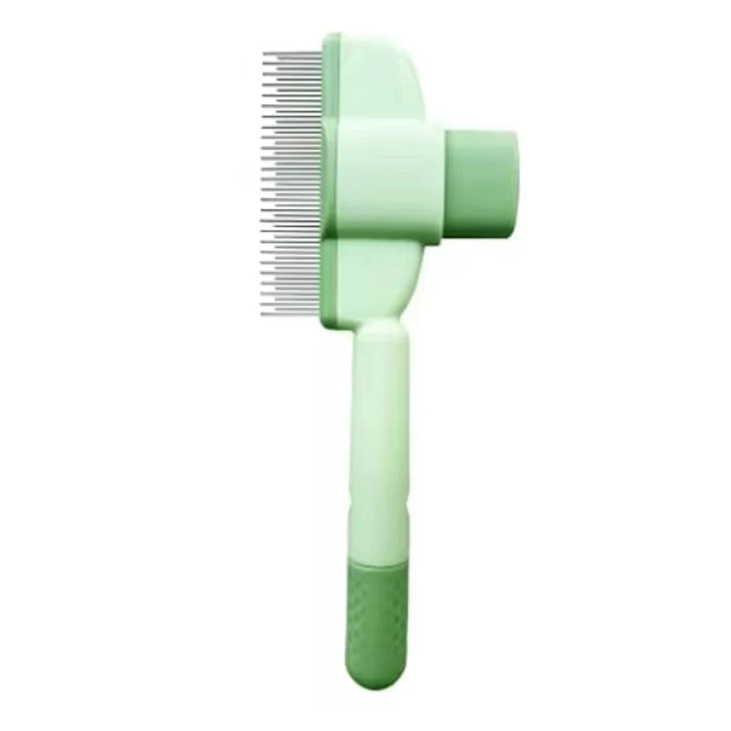 Sage green pet grooming brush with fine metal tines, an ergonomic handle, and a push-button self-cleaning mechanism.