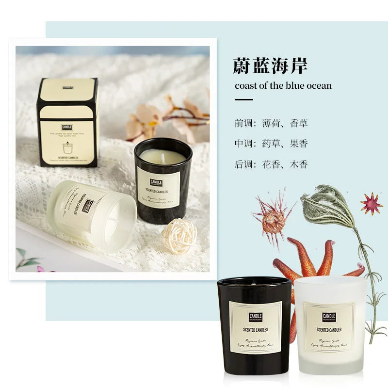 Black and frosted white glass jar scented candles with minimalist cream labels, presented in matching gift boxes.