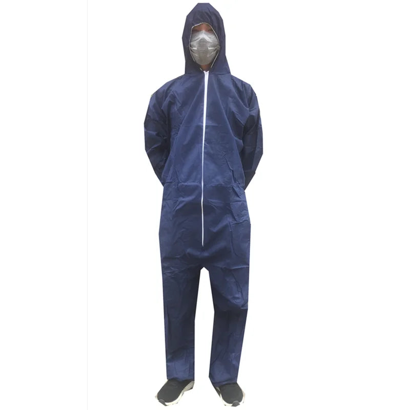 A person wearing a navy blue hooded protective coverall made of synthetic material with a front zipper closure.