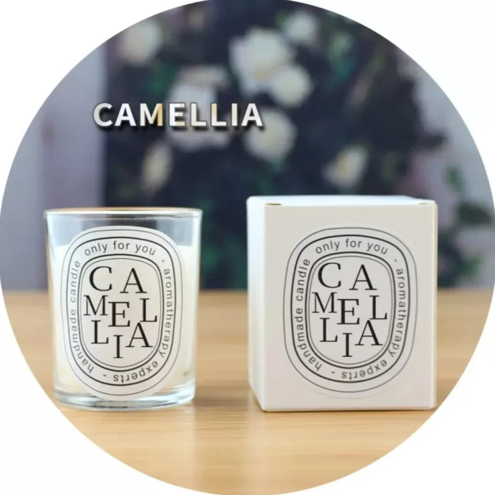 Camellia scented candle in a glass jar with matching white box, featuring elegant black minimalist typography labels.