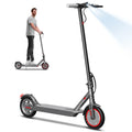 Dark gray AOVOPRO adult electric scooter with 8.5-inch tires, handlebars, bright headlight, and a man riding.