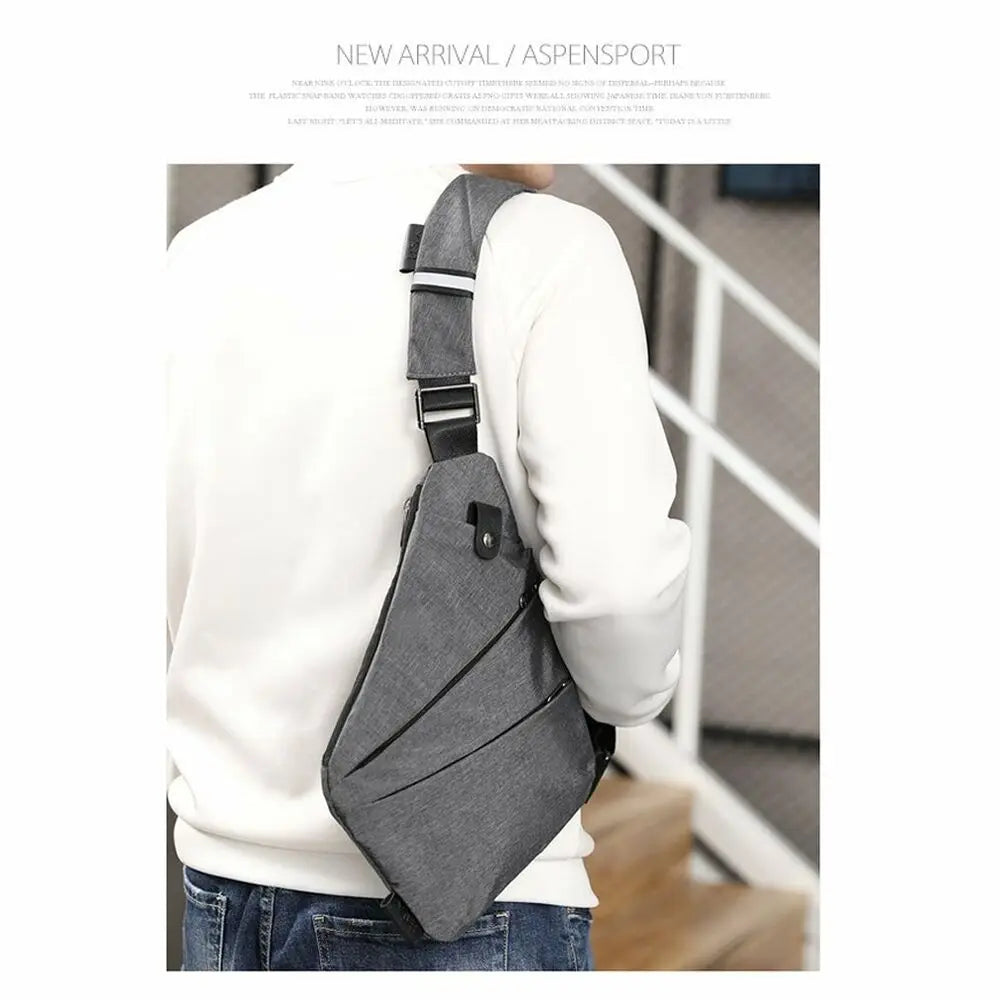 A man wearing a grey, slim-profile waterproof chest bag with a diagonal zip and an adjustable shoulder strap.