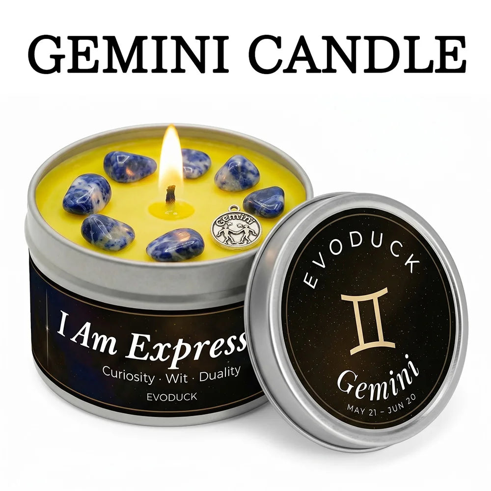 Yellow Gemini zodiac candle in a silver tin, topped with blue crystals and a silver zodiac charm.