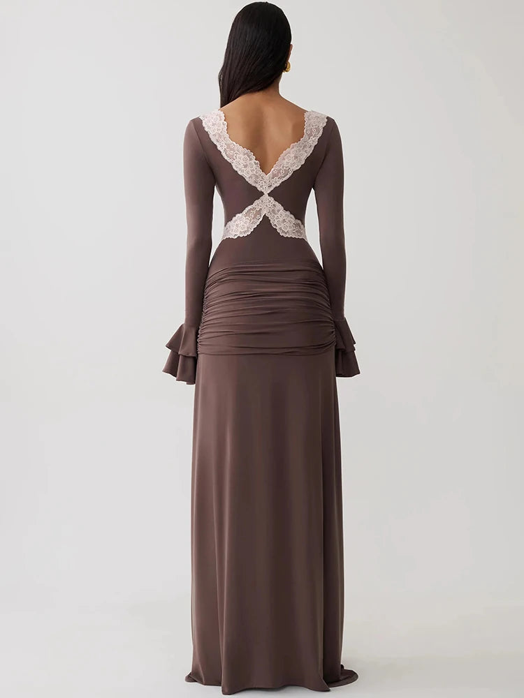 Brown bodycon maxi dress featuring long flare sleeves, ruched lower back, and white lace cross-back detailing.