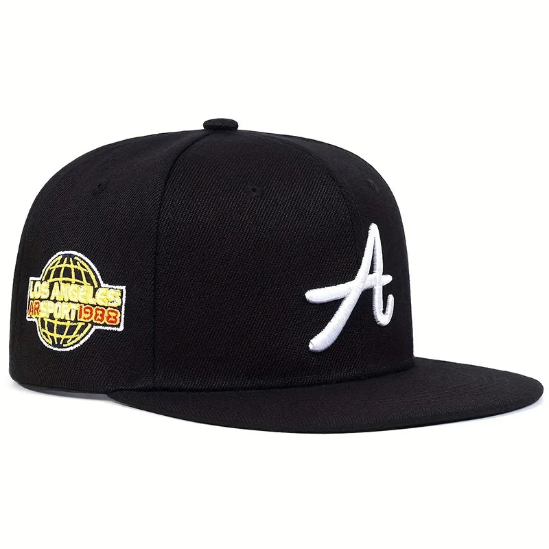 Black baseball cap featuring a white embroidered letter 'A' on the front and a yellow globe logo on the side.