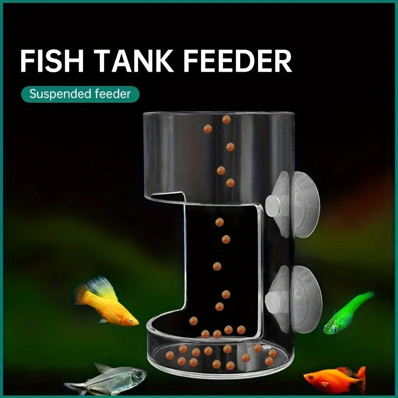 Clear acrylic cylindrical fish tank feeder with suction cups, shown dispensing food pellets into an aquarium.