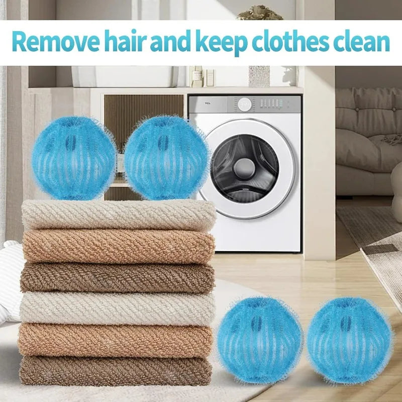 Four blue, textured laundry balls for removing hair and lint, shown with a stack of folded towels and a washing machine.