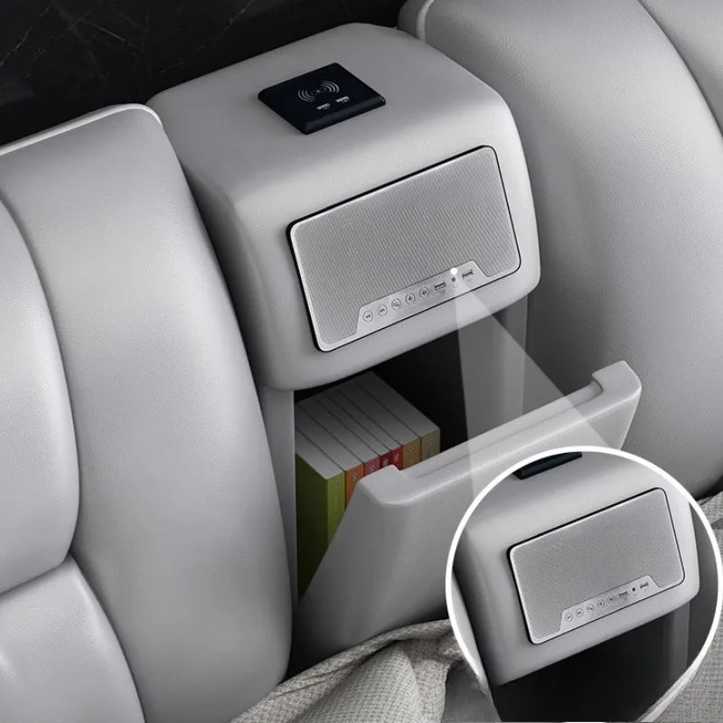 Grey upholstered bed headboard featuring an integrated storage compartment, built-in speaker and wireless charger.