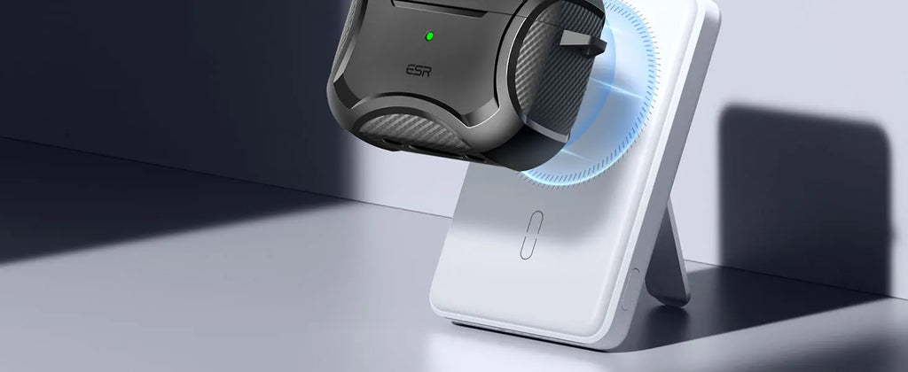 Black carbon fibre-style protective ESR case for AirPods Pro, shown magnetically charging on a white stand.