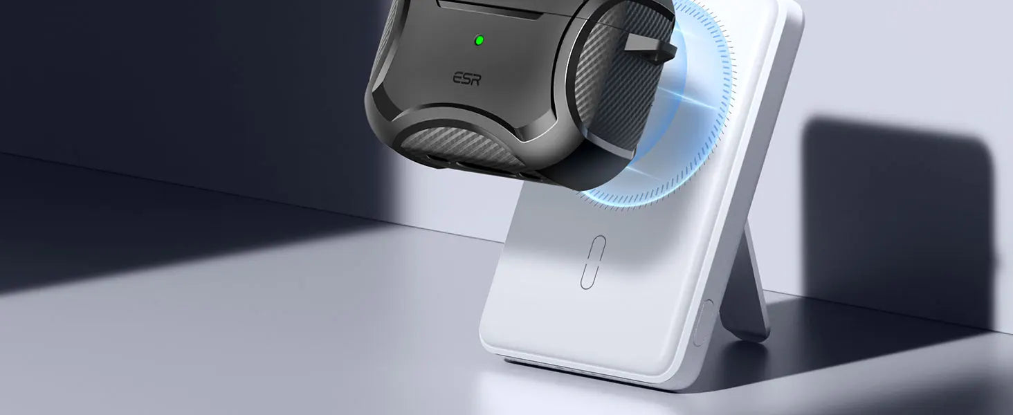 Black carbon fibre-style protective ESR case for AirPods Pro, shown magnetically charging on a white stand.