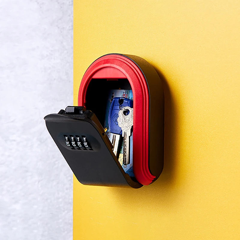 Wall-mounted black and red metal key lock box with a four-digit combination dial and keys inside.