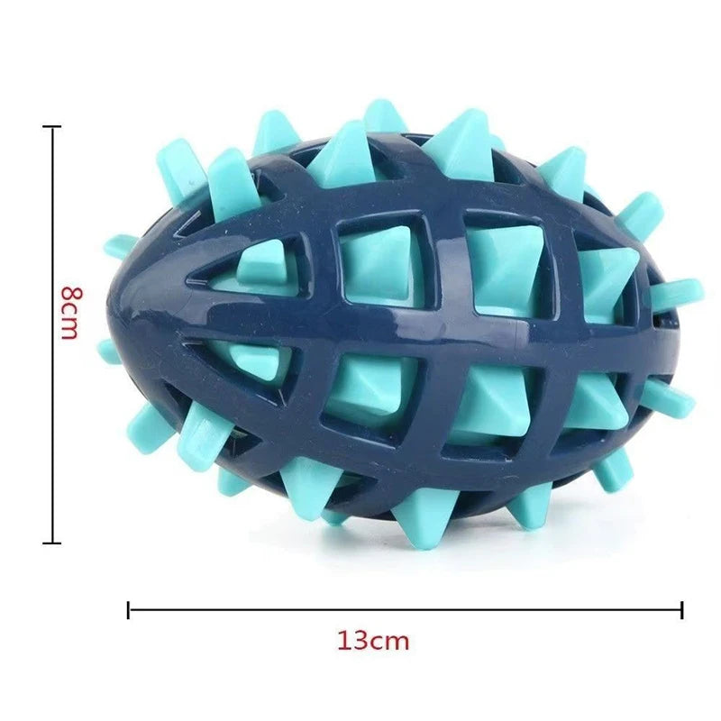 Navy blue and light blue rubber rugby ball dog toy with a spiky, cage-like design. Measures 13cm by 8cm.