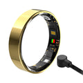 Gold smart fitness ring showing inner electronic sensors and a magnetic charging cable.