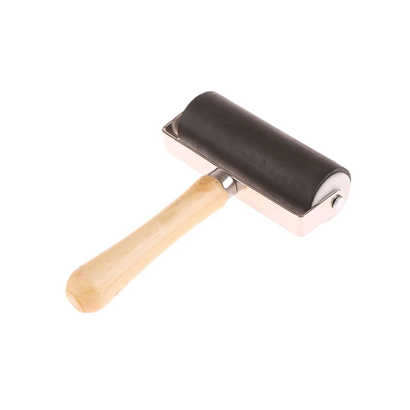 Rubber brayer roller for art and printmaking with a black cylinder and ergonomic light wood handle.