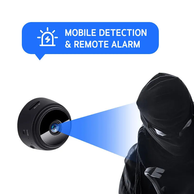 Small black plastic round security camera with motion detection and alarm features monitoring a person in a mask.