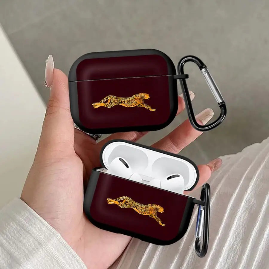 Dark red silicone AirPods Pro case with a cheetah print design, featuring a black carabiner clip.