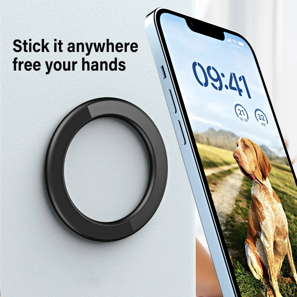A black, circular magnetic smartphone wall mount attached to a surface, holding a smartphone.