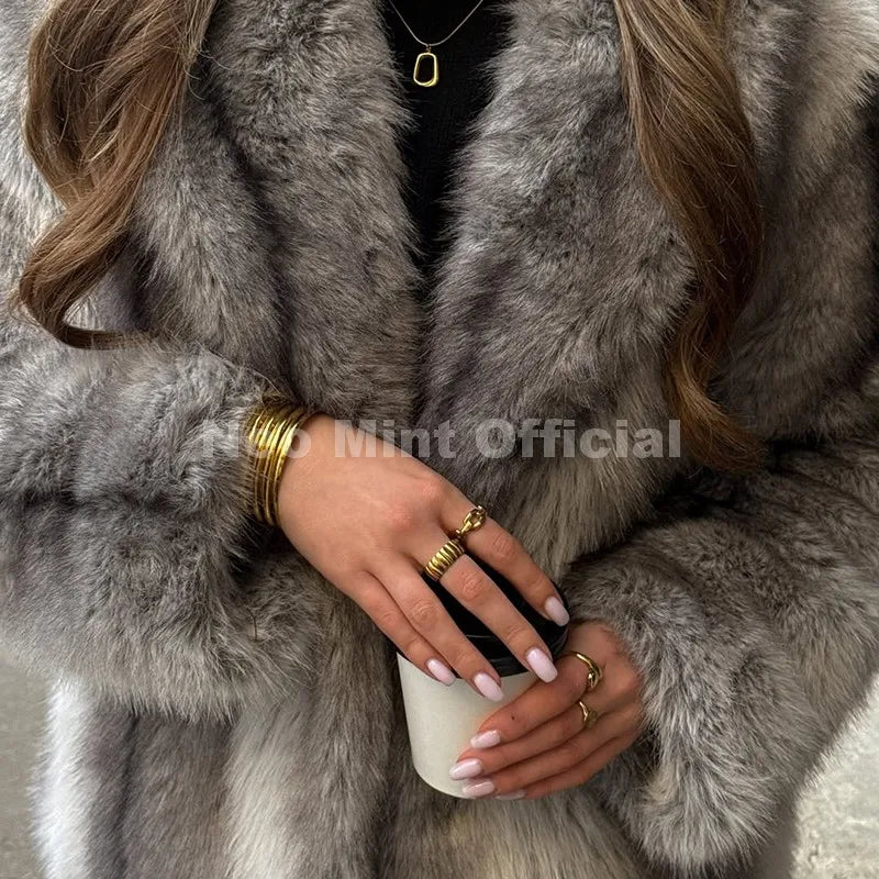 Brown striped faux fur coat with a plush collar, worn over a black top with gold jewelry.