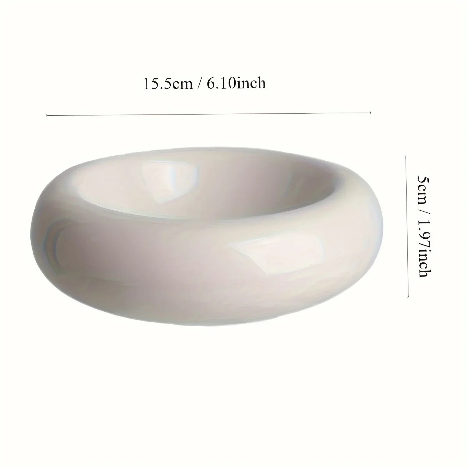 Minimalist, cream-coloured ceramic cat bowl with a smooth, rounded design. 15.5cm wide and 5cm deep.