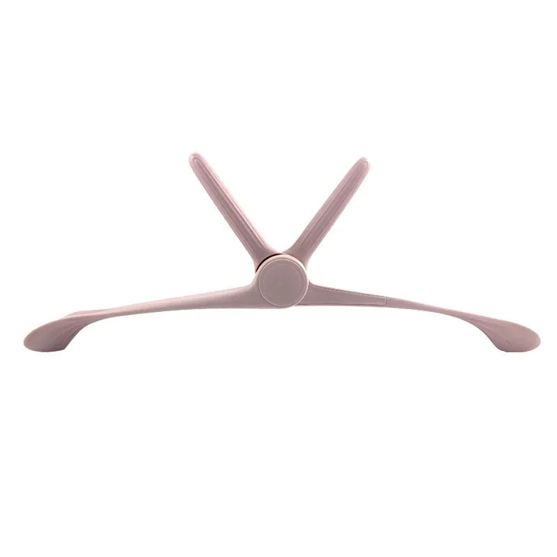 A pale pink, adjustable arm and posture trainer with a central swivel hinge and curved ergonomic support wings.