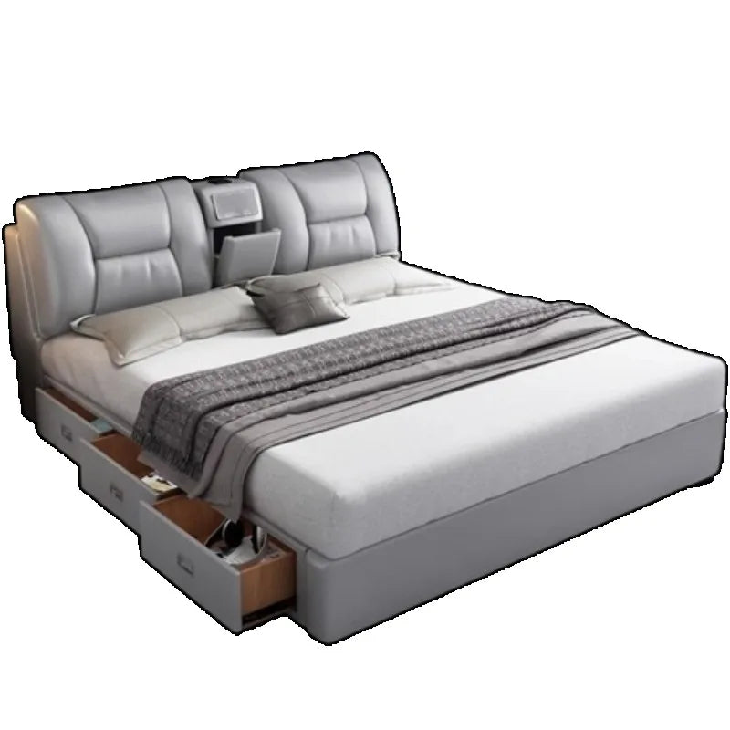 Modern grey upholstered king-size bed with integrated headboard storage and built-in under-bed storage drawers.