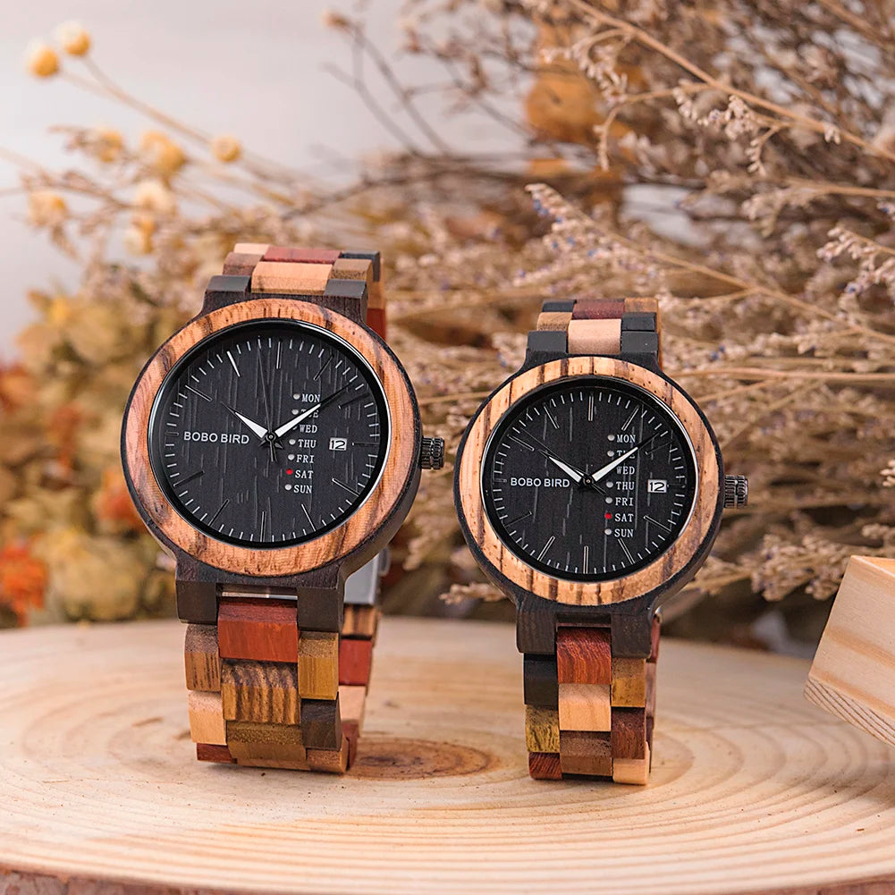 Two round BOBO BIRD wooden couple watches with black faces, date displays, and multicolored wooden link bracelets.