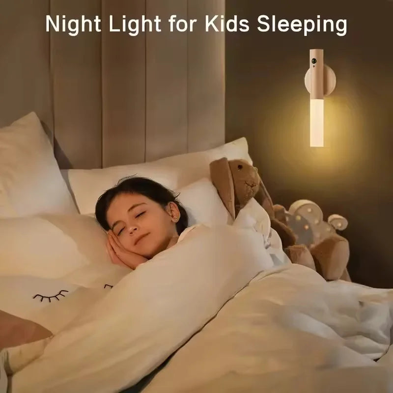 Cream-coloured rechargeable motion-sensor LED wall light mounted by a child’s bed, casting a soft, warm glow.